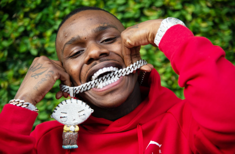 DaBaby is wearing a red hoodie.